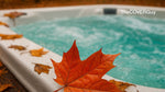 Close-up of a bubbling hot tub with autumn leaves on the edge, highlighting seasonal spa care and protection.